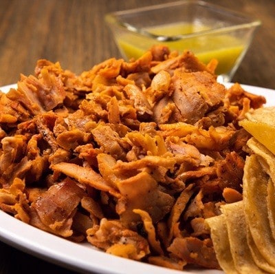 Pastor meat tacos with corn tortillas. Traditional mexican food. Mexican food on wooden background. Mexican taco concept.