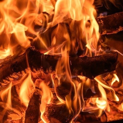 Fire burning in the fireplace, close-up of the orange flames