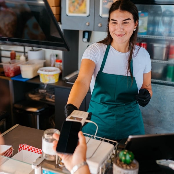 Cashier working in a small Mexican restaurant