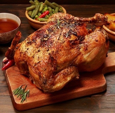 Roast Chicken and Vegetables on a wooden table