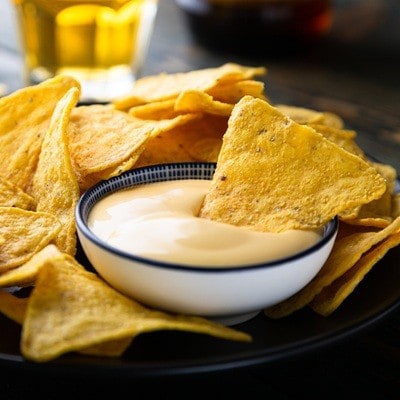 Mexican nacho chips with cheese sauce